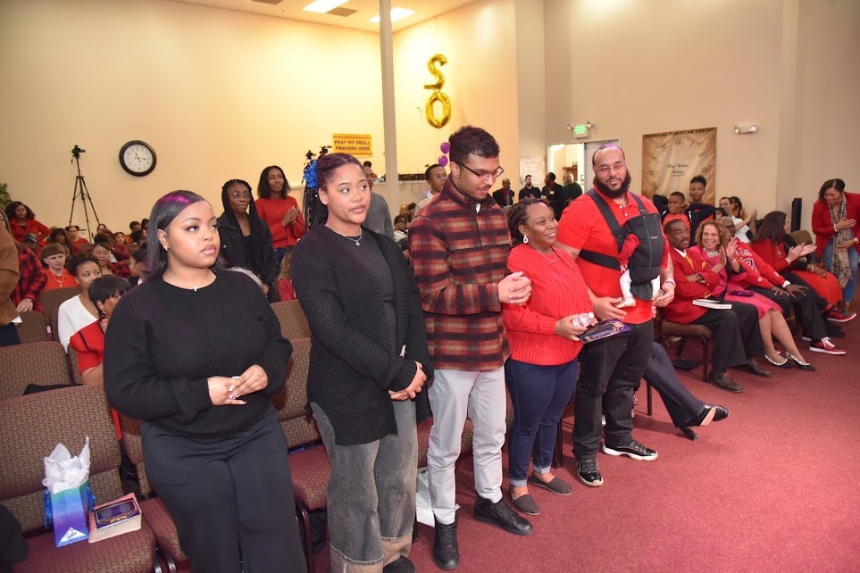 Volunteers standing together in service at Emmanuel Christian Center